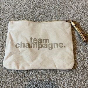 Team champagne cream canvas bag with gold tassel zipper